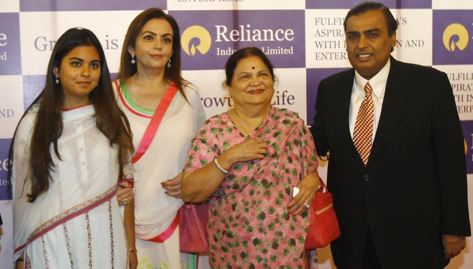 Isha Ambani, with her mother, grandmother, and father